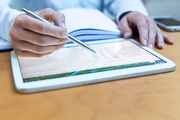 Assessment questionnaire on tablet with planning materials